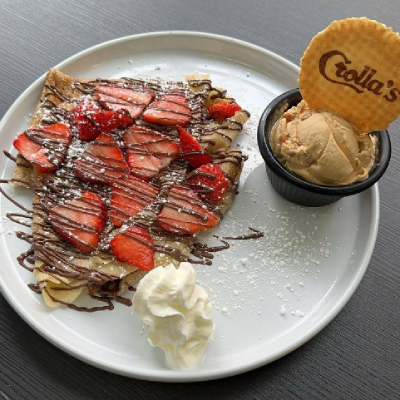 A delightful Simply Treatz golden crepes, topped with honey, ready to be enjoyed.